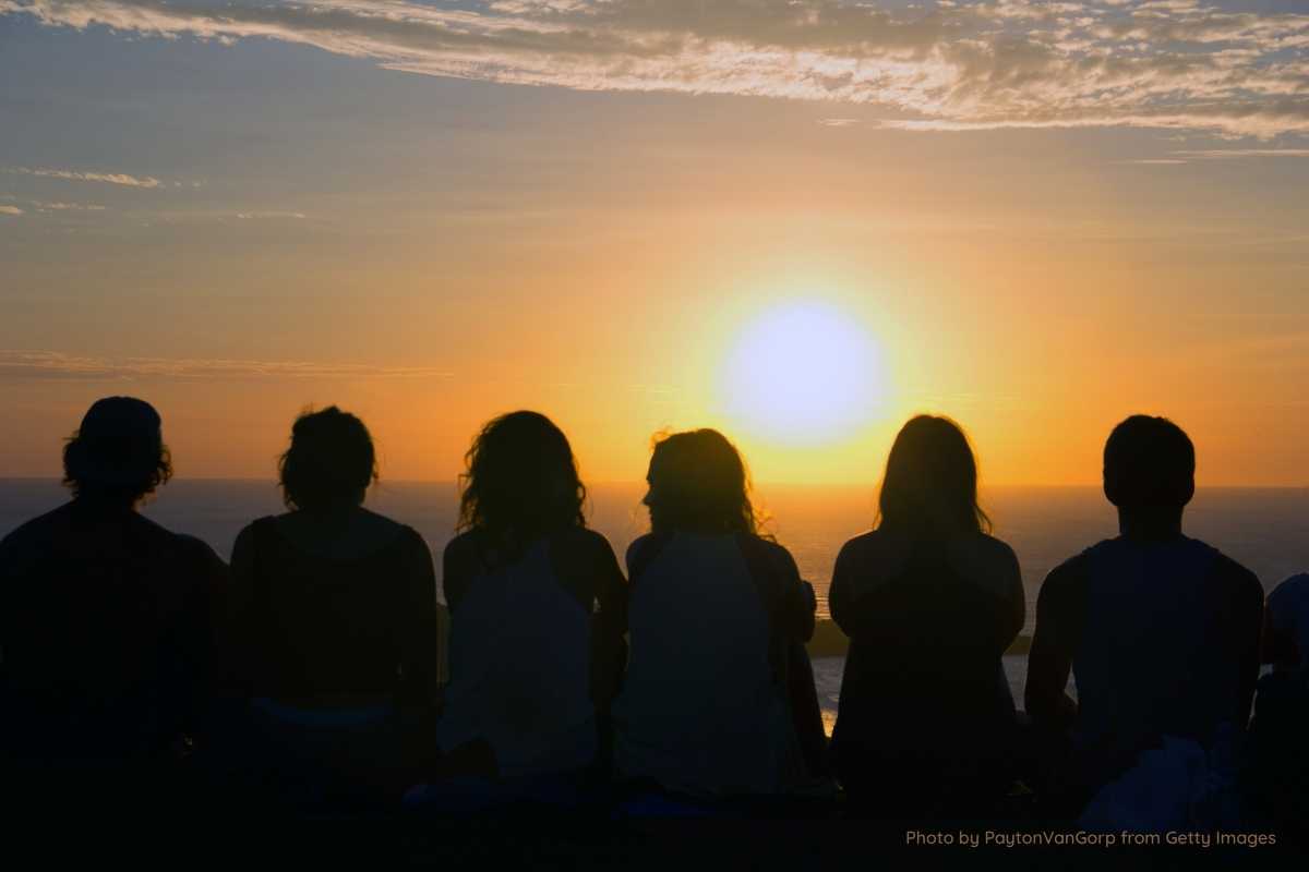 Group of people looking at the sunset